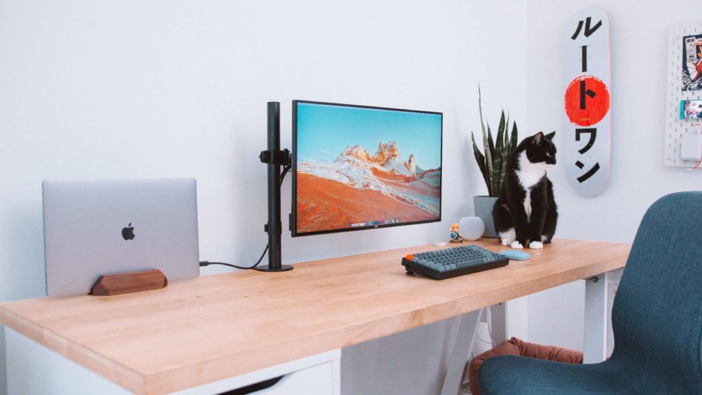 minimalist laptop desk setup